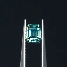 1.26CT EMERALD CUT MADAGASCAR SAPPHIRE, TEAL TO GREY, 5.7X4.79X4.44MM